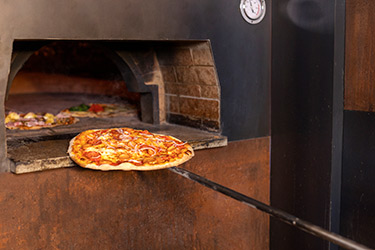 La Pizza classique vendue en Pizzéria